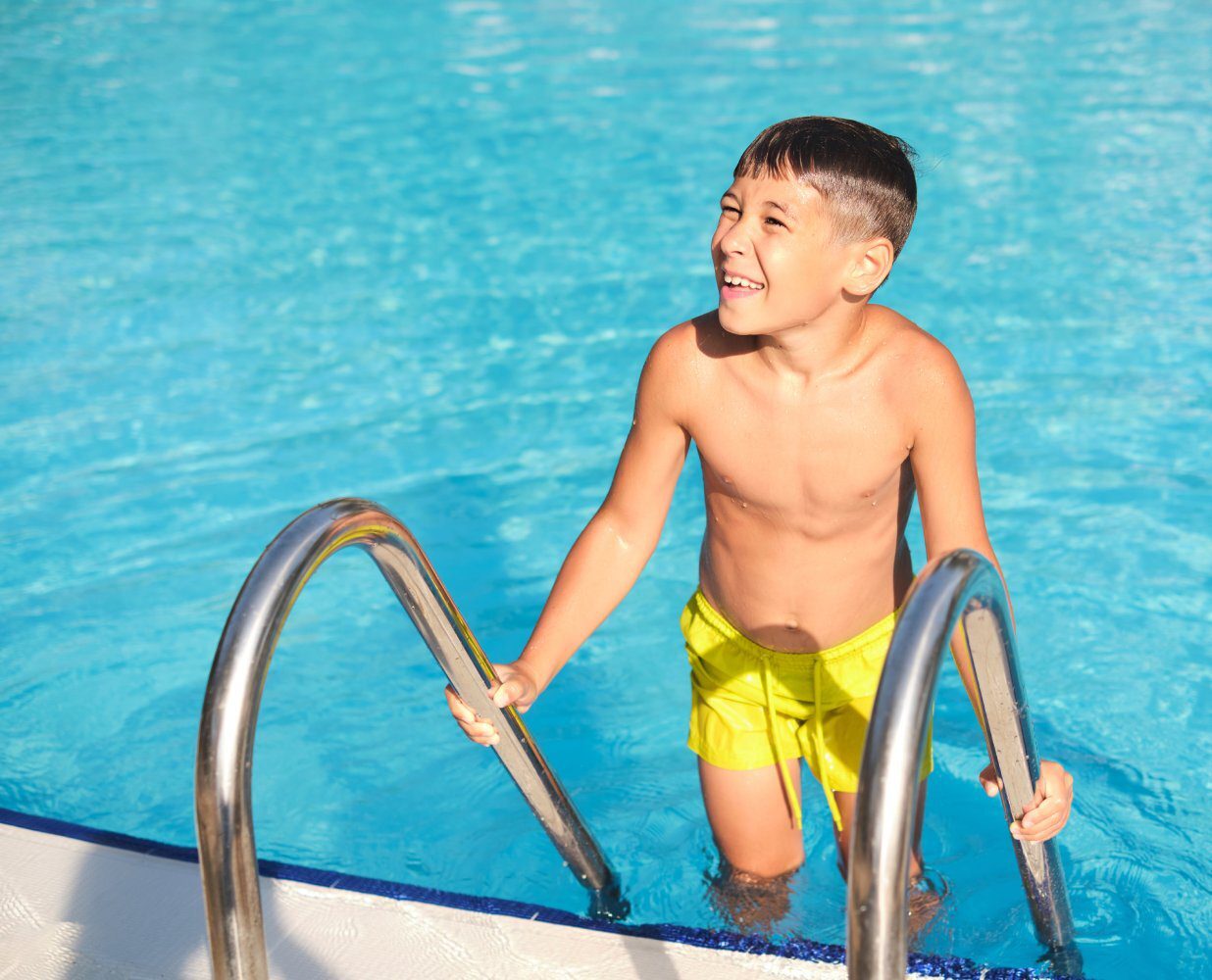 kid in swimming pool