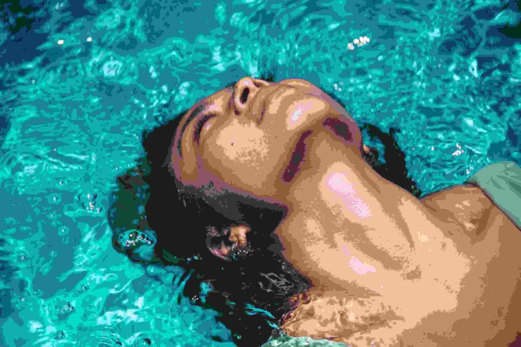 Adult swim student practicing breathing techniques.


