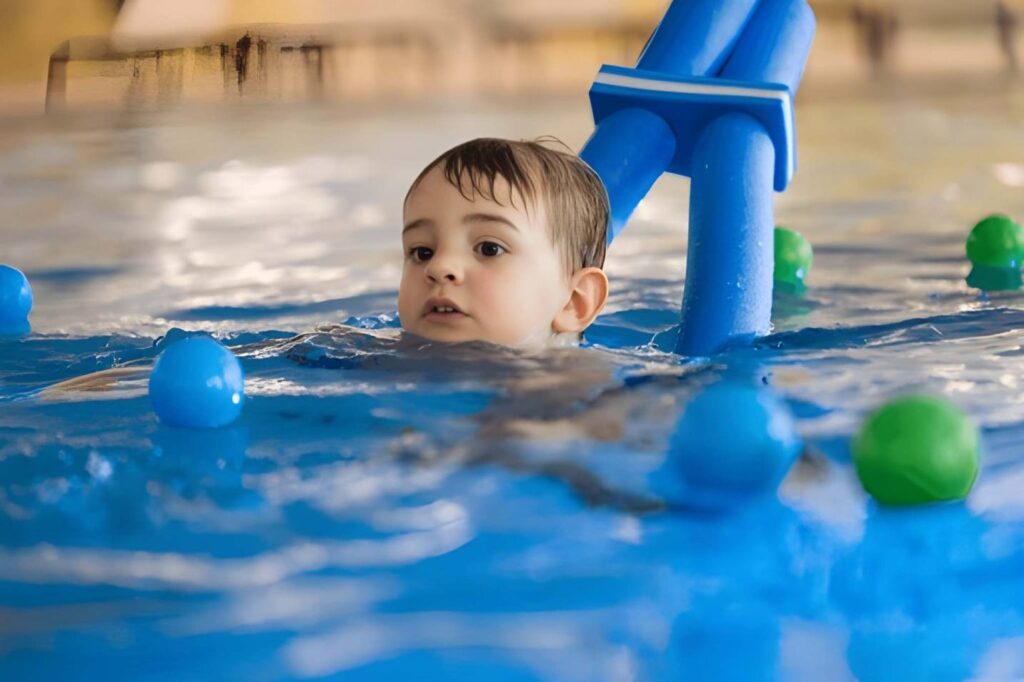 A happy child experiencing the calming mental benefits of swimming.